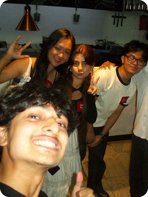 A selfie of the Katharchive team at a restaurant