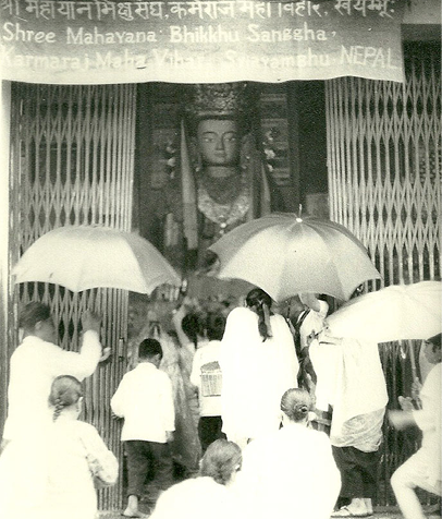 Devotees gathered under umbrellas at Shree Mahayana Bhikkhu Sanggha, Swayambhu